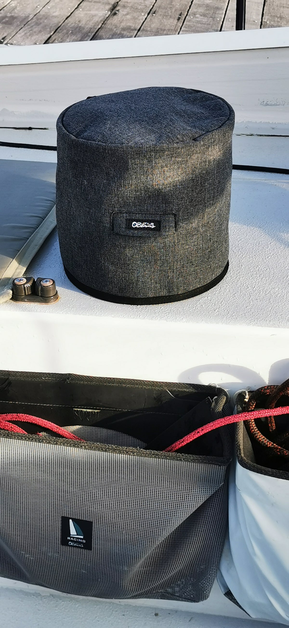 Black drum case with a brand logo on a white surface