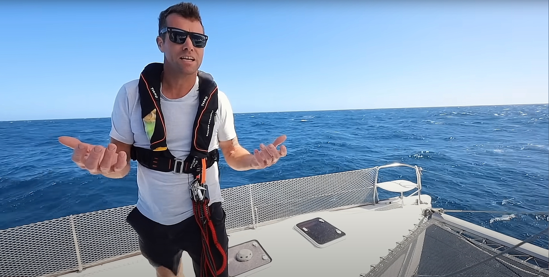 Picture of Ben from Sailing Nahoa wearing a TeamO Offshore PFD from Indie Marine in his sailing video https://youtu.be/cqNOjVgDpQg?t=563