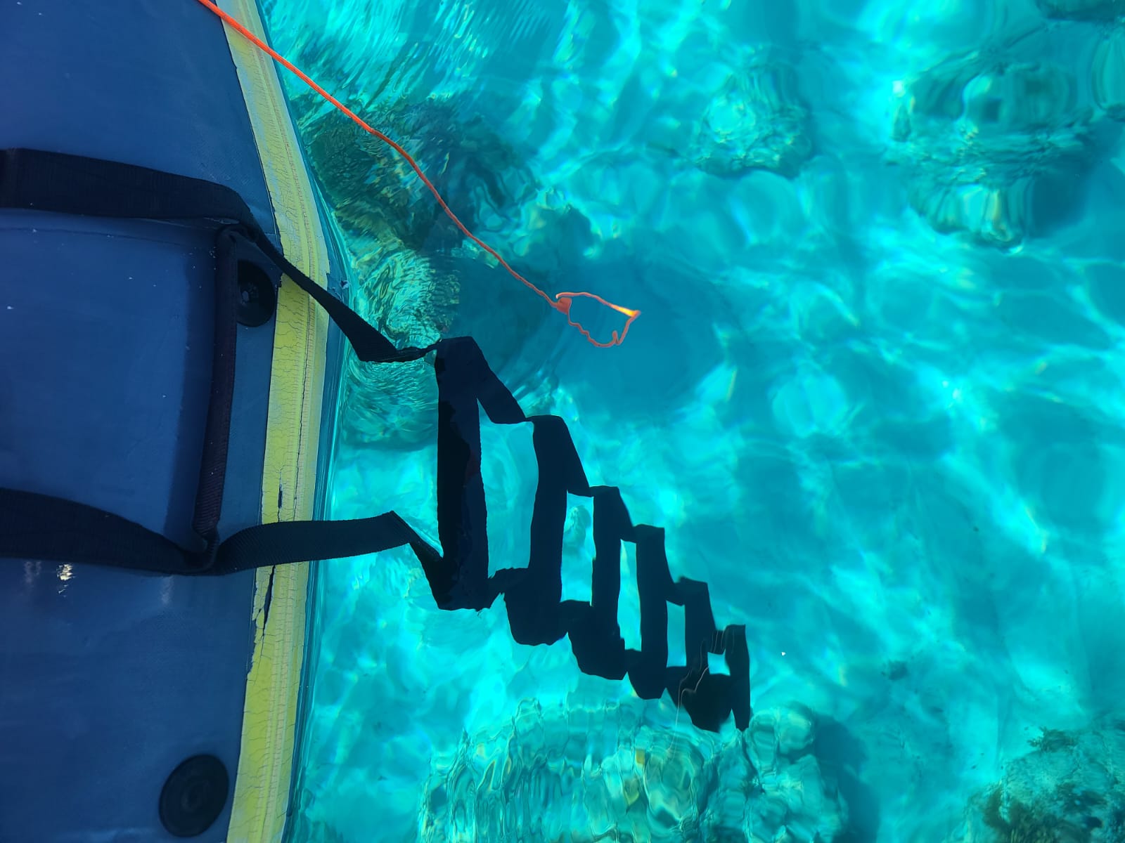 This is a picture of the emergency ladder being used on a dinghy when snorkeling. It is clipped inside the boat and the rungs were slung over and into the water. This worked very well. 